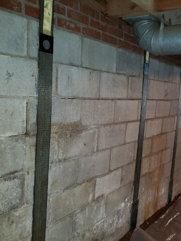 carbon fiber straps used to stabilize a leaning wall on a home in Western North Carolina of North Carolina.