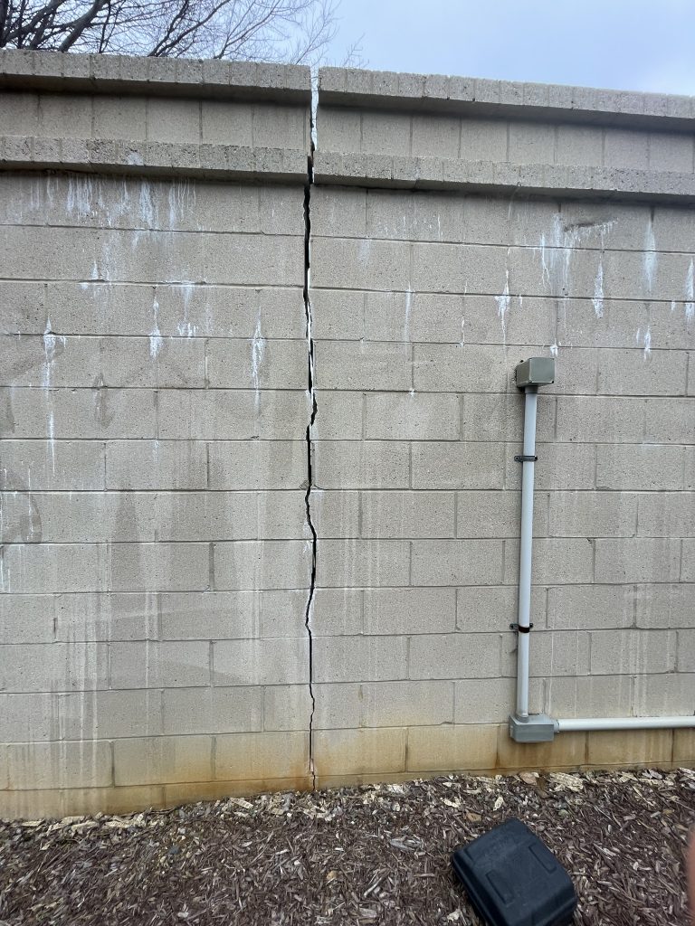 vertical concrete wall crack outside visual