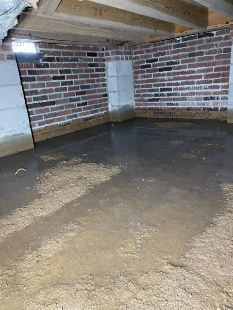 A crawlspace holding water and draining poorly in Western North Carolina
