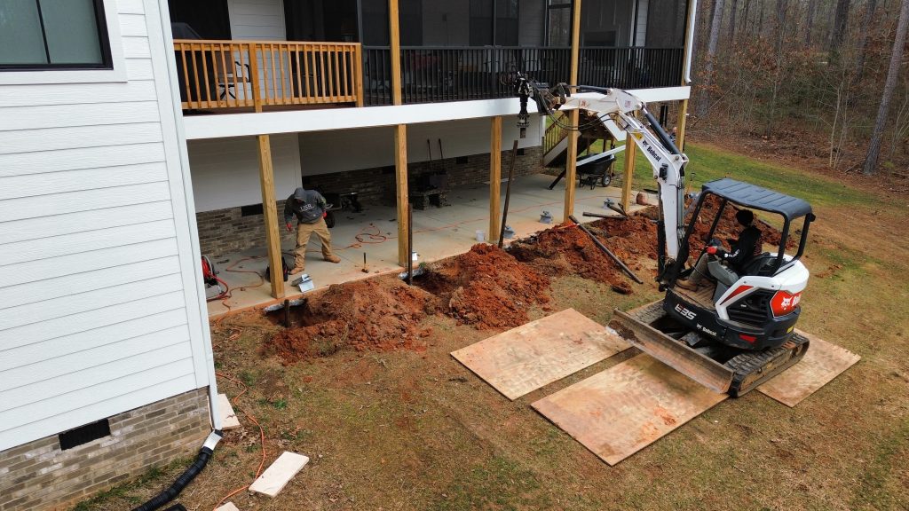 WNC installing six helical piles on a sinking deck in Salem North Carolina
